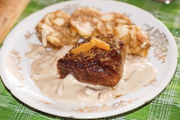 Roasted rib steak with mushroom cream sauce and dumpling