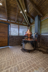 Cauldron for brandy in modern log cabin interior