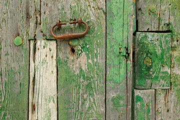 Green painted wood with rusty handle
