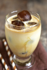 Milk with coffee ice cubes.