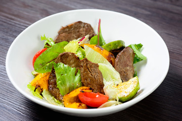 salad with meat,egg, tomatoes, olives and vegetables