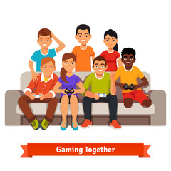 Group of teen friends having a video games party