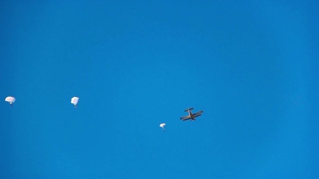 skydivers jump from a plane