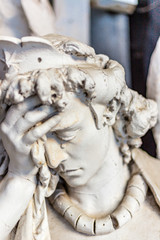 Fototapeta premium dusted statue of crying angel