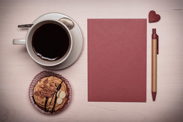 empty cup cupcake and red blank paper