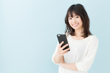 attractive asian woman on blue background