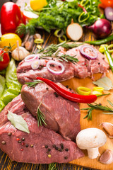 Onions, peppers and rosemary on red meat