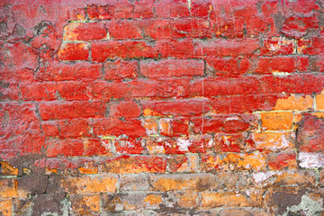 Grungy painted in red wall half orange