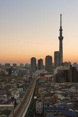 Fototapeta na wymiar Tokyo Skyline at dusk, view of Asakusa district Skytree visible in the distance.