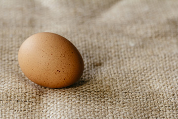 Brown egg on hessian