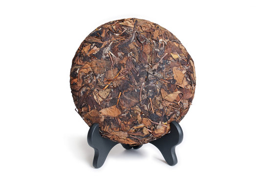 Puerh Raw tea cake isolated