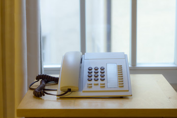 Telephone in an office window.