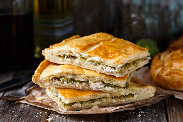 Homemade pie stuffed with chicken ang broccoli