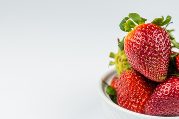 Half of strawberry isolated on white background
