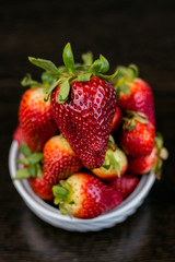 Half of strawberry isolated on black background