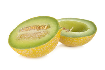 half cut galia melon with seeds on white background