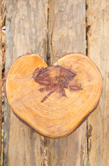 a heart shape wooden sit