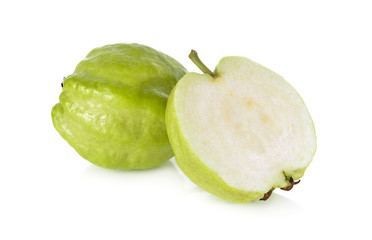 whole and half cut fresh Guava with stem on white background