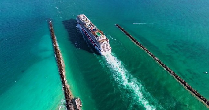 MIAMI BEACH, FLORIDA: Cruise ship enter to Atlantic ocean from Government Cut canal. 4K video. 