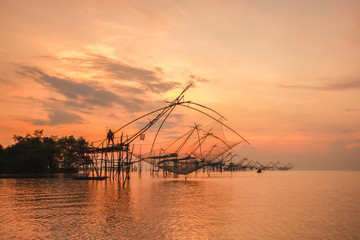Fototapeta na wymiar Thai style fishing trap in Pak Pra Village, Net Fishing Thailand, Thailand Shrimp Fishing, Phatthalung, Thailand.