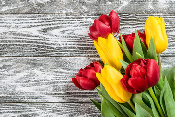 Fototapeta na wymiar Holiday Tulip Flowers on Wooden Background