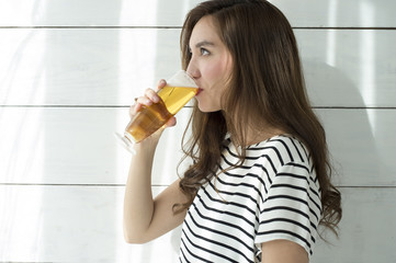 Young women are drinking beer at a stretch