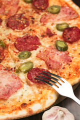 Italian pizza with hot jalapeno pepper and pepperoni