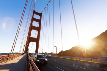 Fototapeta premium traffic on gold gate bridge in fine day