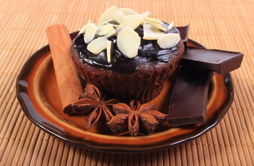 Baked muffins with pieces of chocolate, anise and cinnamon