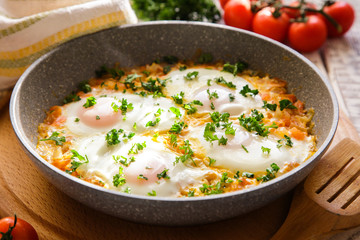 Shakshuka - traditional dish of israeli cuisine in a skillet