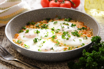 Shakshuka - traditional dish of israeli cuisine in a skillet