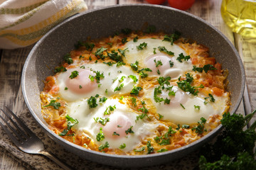 Shakshuka - traditional dish of israeli cuisine in a skillet