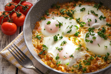 Shakshuka - traditional dish of israeli cuisine in a skillet