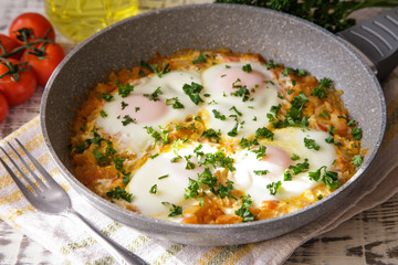 Shakshuka - traditional dish of israeli cuisine in a skillet