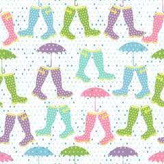 Seamless pattern with colored rubber boots and umbrellas under rain.