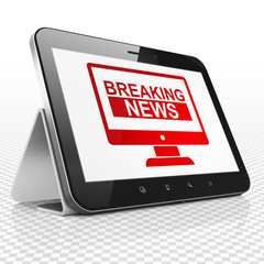 News concept: Tablet Computer with Breaking News On Screen on display