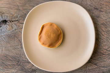 Japanese Traditional Dessert : Dorayaki in dish on Wooden table