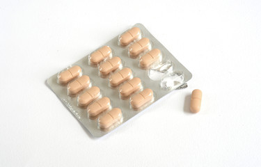 pills, tablets and drugs on white background.
