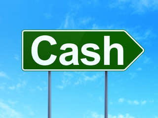 Banking concept: Cash on road sign background