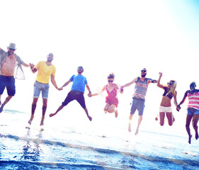 Obraz premium Diverse Beach Summer Friends Fun Jump Shot Concept