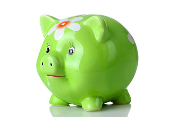 cute green piggy Bank with painted flower on a white isolated background