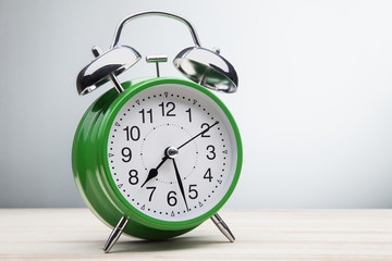 green alarm clock morning wake-up time