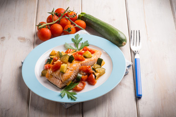 salmon with fresh tomatoes and zucchinis