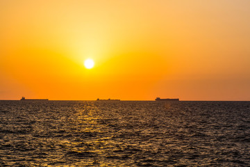 Obraz premium large ships on sunset background