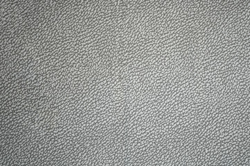 Grey fabric background with leather print