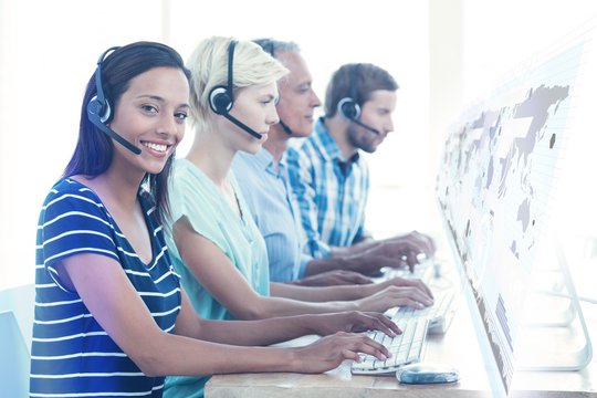 Composite image of casual call centre workers in the office