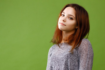 Fototapeta premium Teenage girl on green background