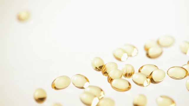 Capsules Omega-3 on the white background