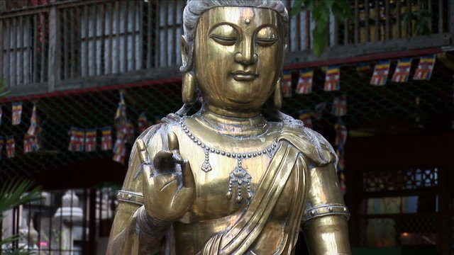 Gold statue inside the Gangaramaya Temple in Colombo, Sri Lanka
