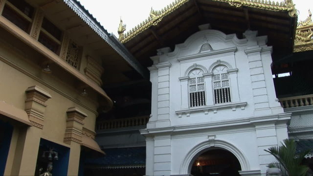 Tilt up the exterior of the Gangaramaya Temple in Colombo, Sri Lanka